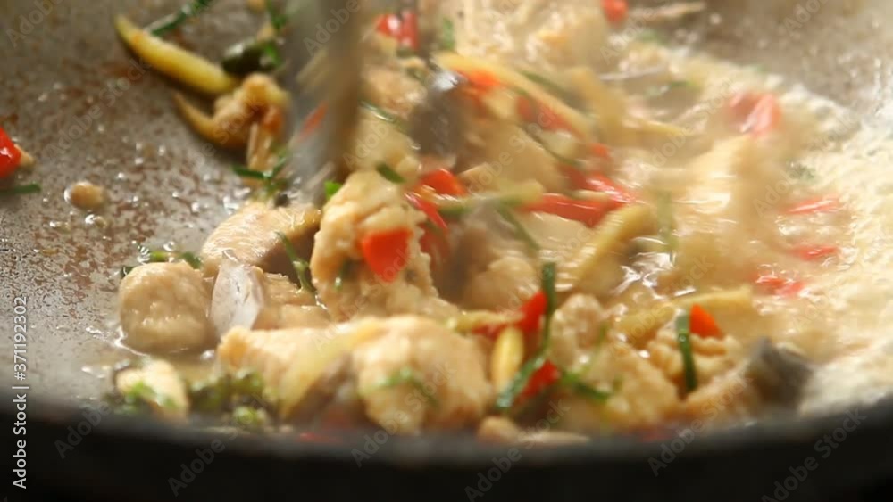 Frying chopped fish  with finger root and herb in pan , in door  Chiangmai  Thailand