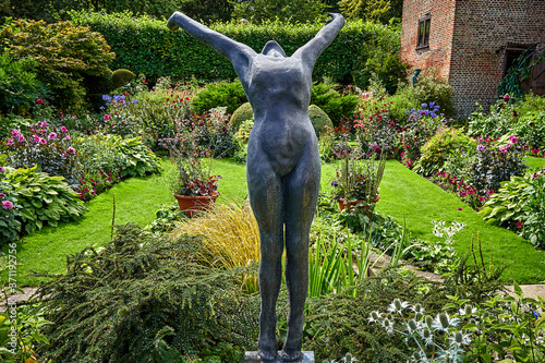 Statue stretching in garden photo