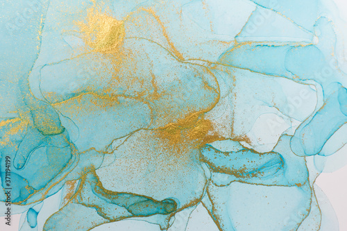 Abstract watercolor transparent drops background. Blue and golden glitter texture.