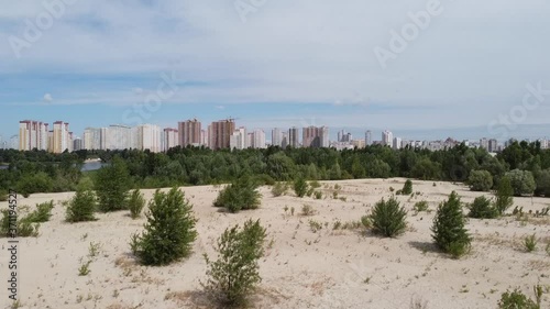 Kyiv aerial cityscape with flight up above the sand massive  photo