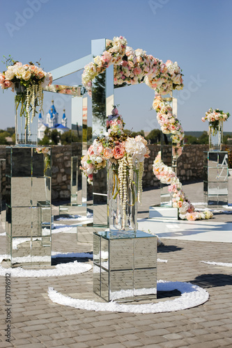 Wedding decoration of mirrors and flowers for the wedding ceremony