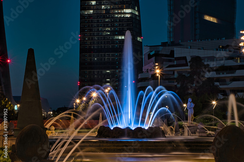 Colorful, stunning Fountain of The Four Seasons, Fontana delle Quattro Stagioni at Julius Caesar Square, Piazzale Giulio Cesare during the night. Long exposure photography