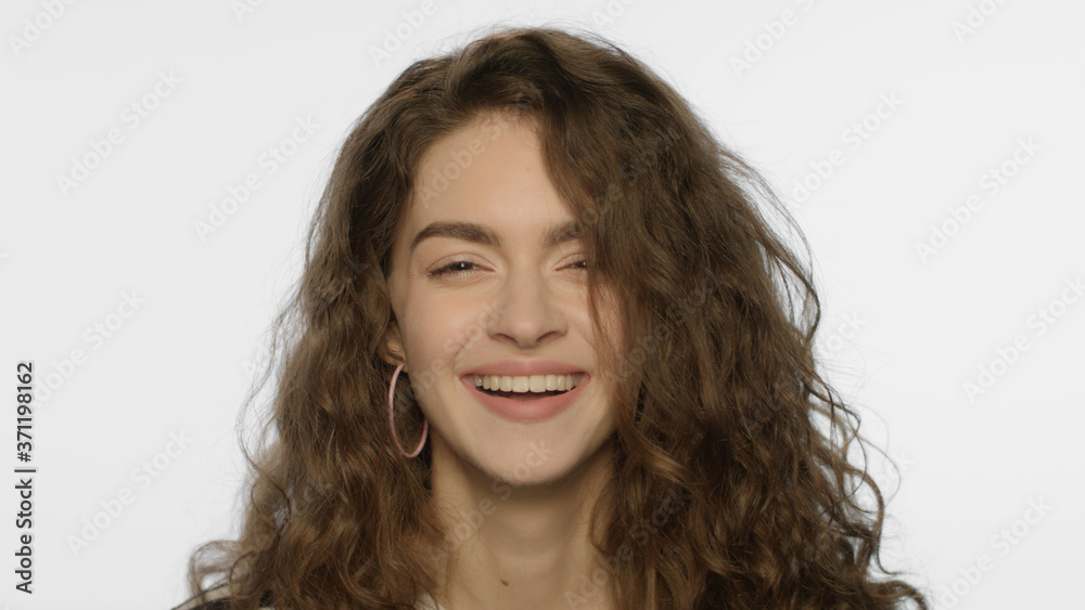 Happy woman smiling on camera. Laughing woman face. Happy girl laughing Happy woman smiling on camera. Laughing woman face. Happy girl laughing