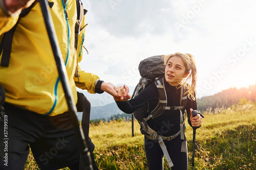 In adventure together. Cute couple. Majestic Carpathian Mountains. Beautiful landscape of untouched nature