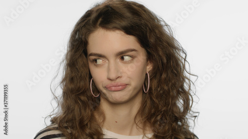 Fotografi Skeptical woman face expression