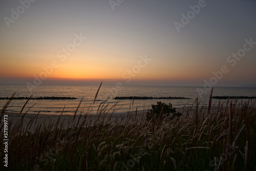 Gradation colors of sunset into the sea