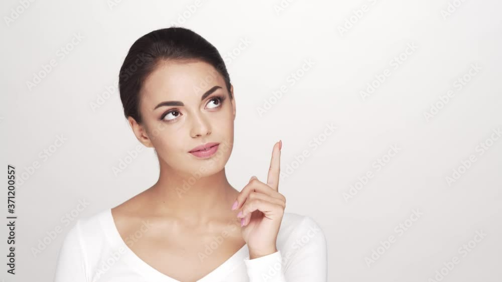 Studio portrait of young and beautiful brunette woman