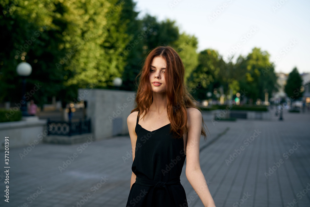 fashionable woman on city street in black dress and hat glasses makeup model watch on hand fresh air