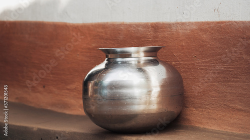 Photography Metallic pot in a village used for water storage