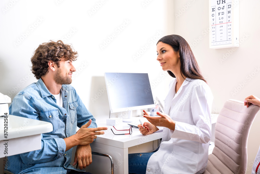 A female Doctor explaining a Diagnosis in the consultation room A female Doctor explaining a Diagnosis in the consultation room