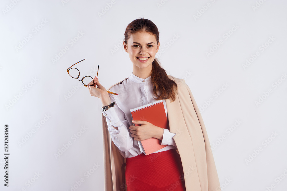 Happy female student with a notebook in hands and education science Light clothes glasses Red skirt Happy female student with a notebook in hands and education science Light clothes glasses Red skirt