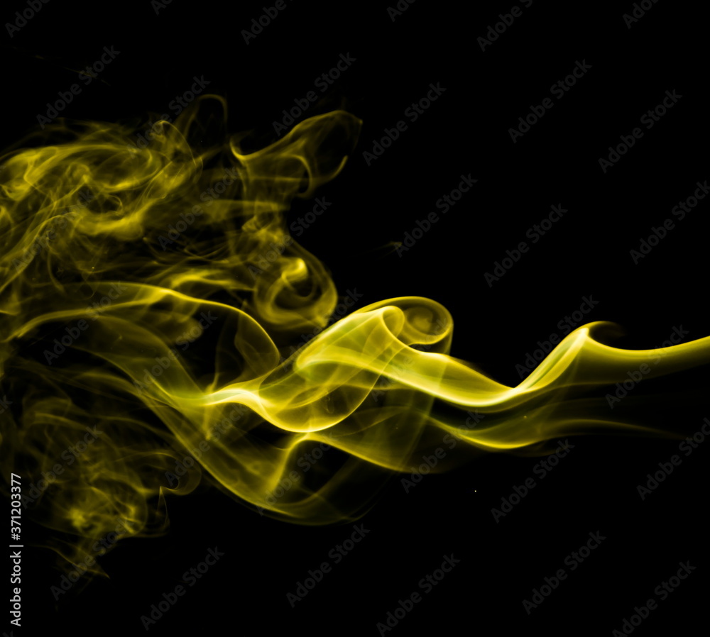Yellow smoke on black background Yellow smoke on black background