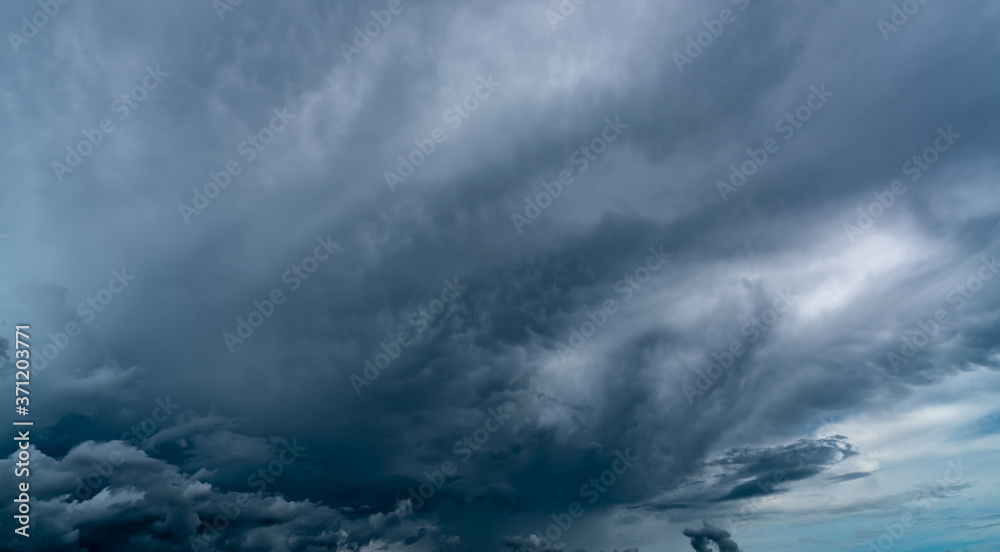 Dark dramatic sky and clouds. Background for death and sad concept. Gray sky and fluffy white clouds. Thunder and storm sky. Sad and moody sky. Nature background. Dead abstract background. Cloudscape. Dark dramatic sky and clouds. Background for death and sad concept. Gray sky and fluffy white clouds. Thunder and storm sky. Sad and moody sky. Nature background. Dead abstract background. Cloudscape.