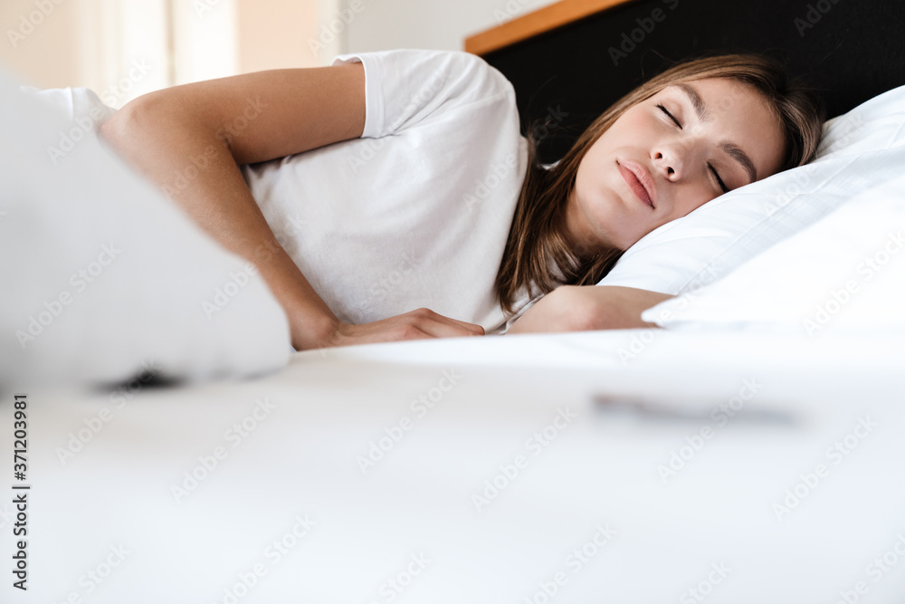 Attractive young woman sleeping in bed Attractive young woman sleeping in bed