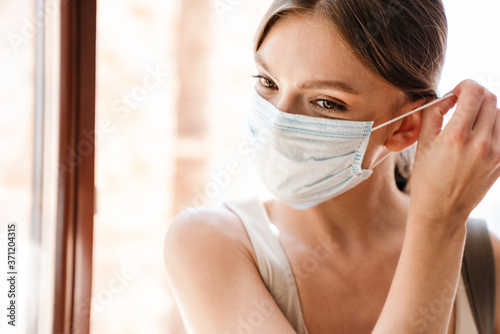 Close up of a young woman wearing medical mask