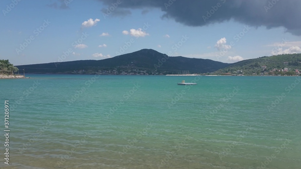 Pontoon on a clear aqua blue sea water.