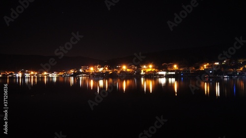 Night scene with light and reflection at Balikliova, Urla, izmir, Turkey.