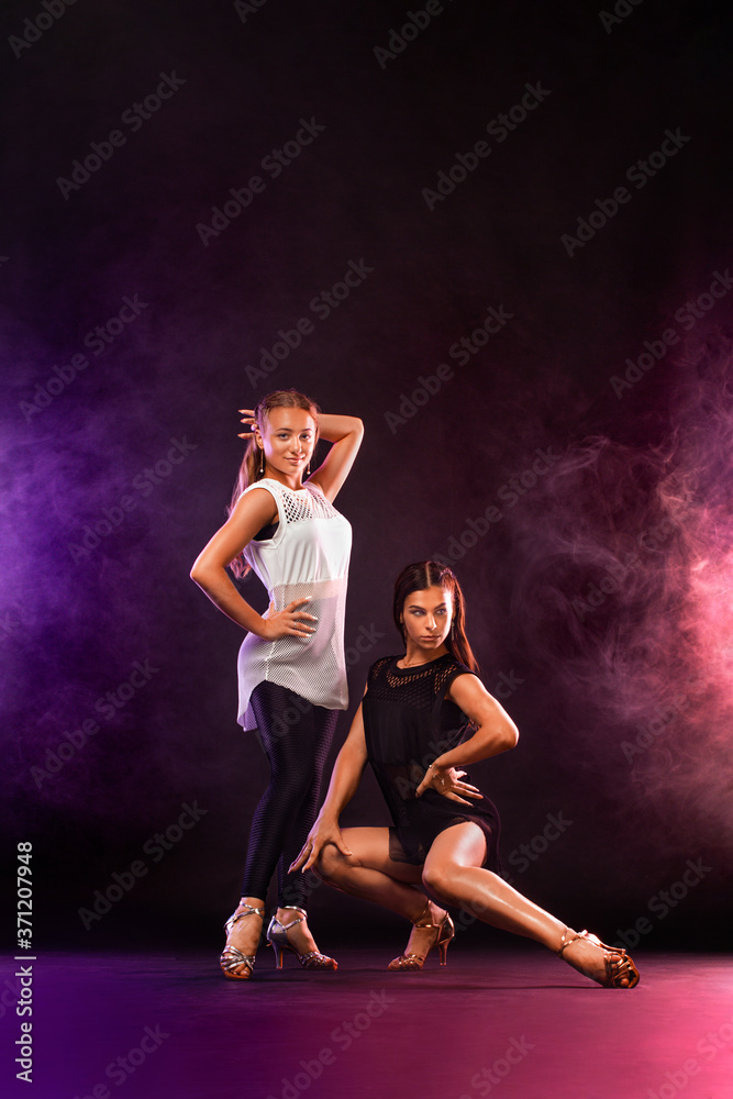 Girls dancers dancing sports ballroom dancing.
