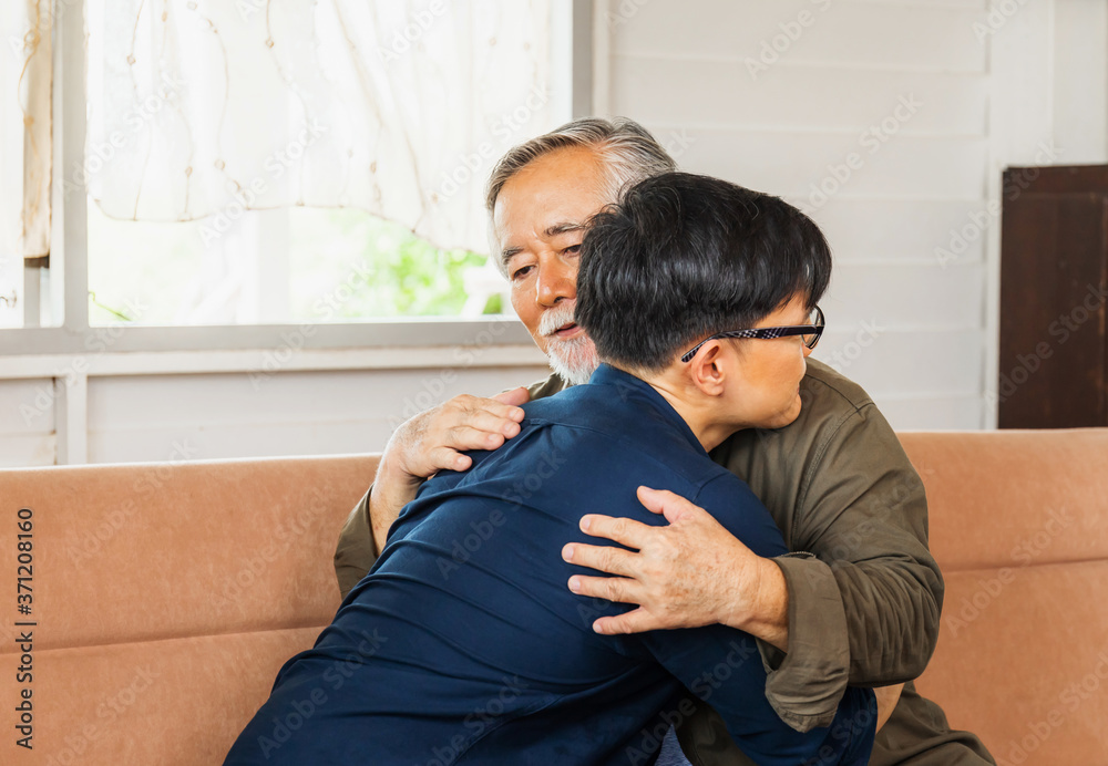 Senior asian father give advice adult son in living room, Happiness family concepts Senior asian father give advice adult son in living room, Happiness family concepts