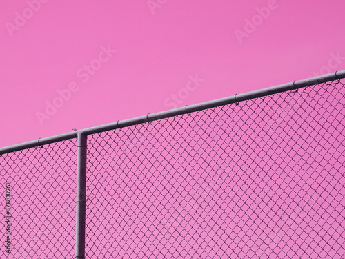 wire mesh of fence isolated on pink background