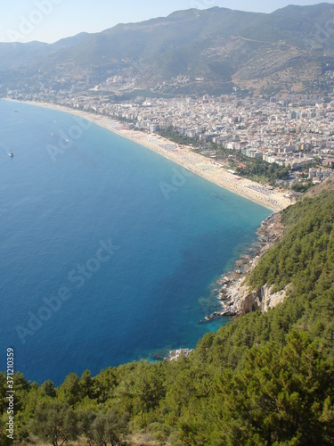 View beach of the Alanya coast from mountain. Boats floats in mediterian sea. © Maxim