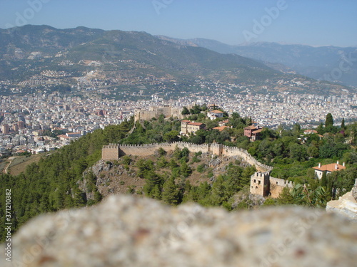 Castle or fortress Alanya with an impregnable stone wall on the mountain in Turkey of the Mediterranean