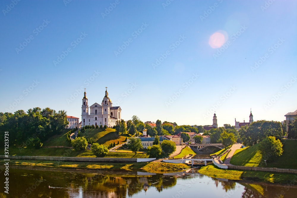 Naklejka premium Vitebsk,Belarus - 18 July 2020 : Holy Assumption Cathedral of the Assumption on the hill and the Holy Spirit convent and Western Dvina River. Vitebsk, Belarus
