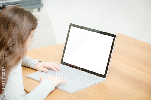 Child Uses a Computer for School Work
