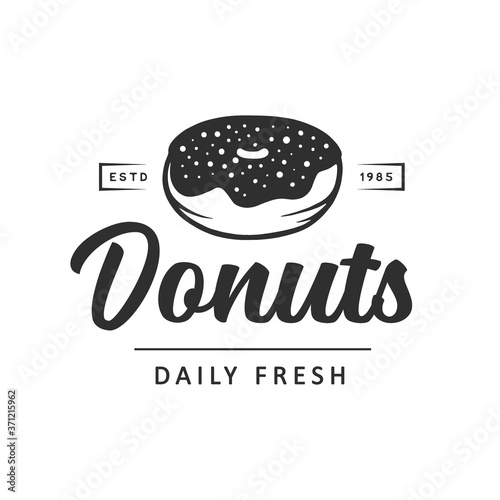 Vintage style bakery shop simple label, badge, emblem, logo template. Graphic food art with engraved doughnut design vector element with typography. Linear organic donut on white background.