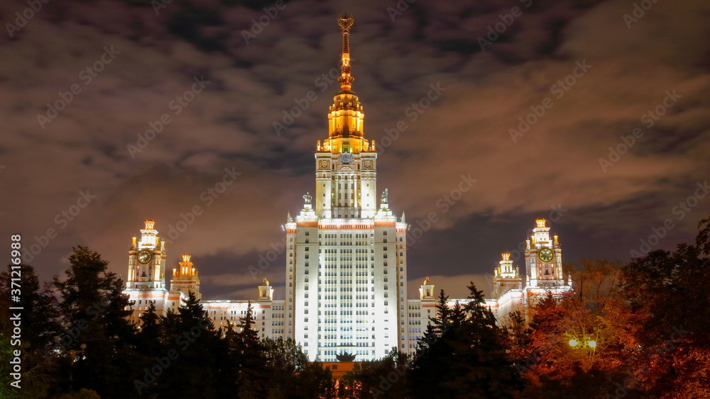 Side view of enlightened monumental Lomonosov university in Moscow at night