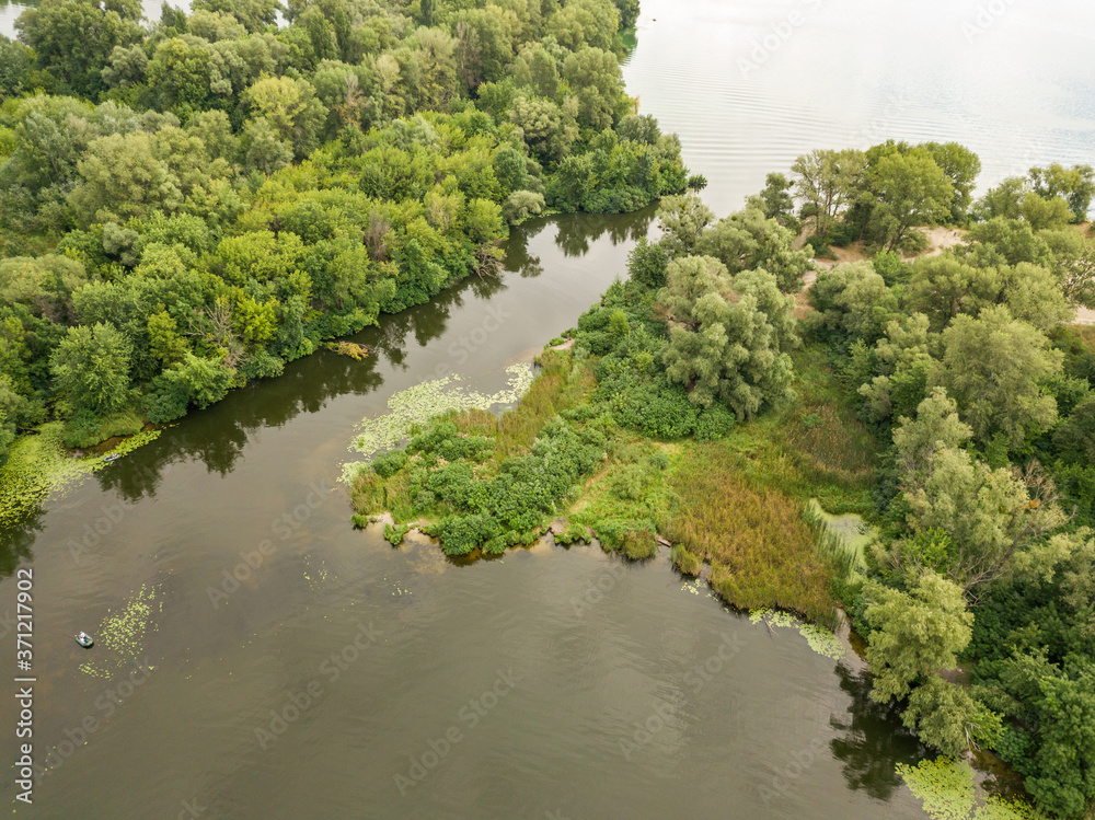 Aerial drone view. Fishing boat on the river on a summer day. Aerial drone view. Fishing boat on the river on a summer day.