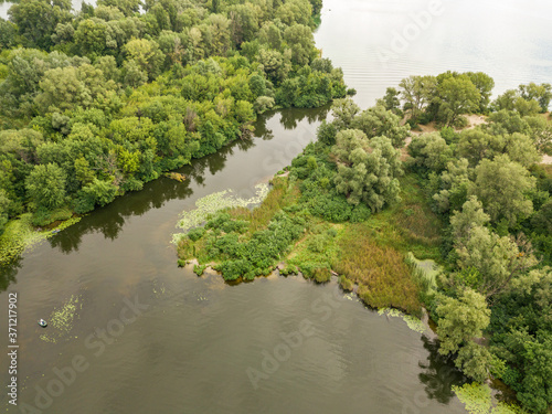 Aerial drone view. Fishing boat on the river on a summer day.