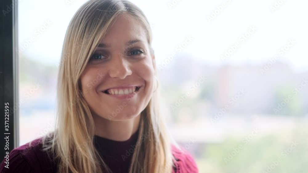 Portrait of smiling businesswoman at window Portrait of smiling businesswoman at window