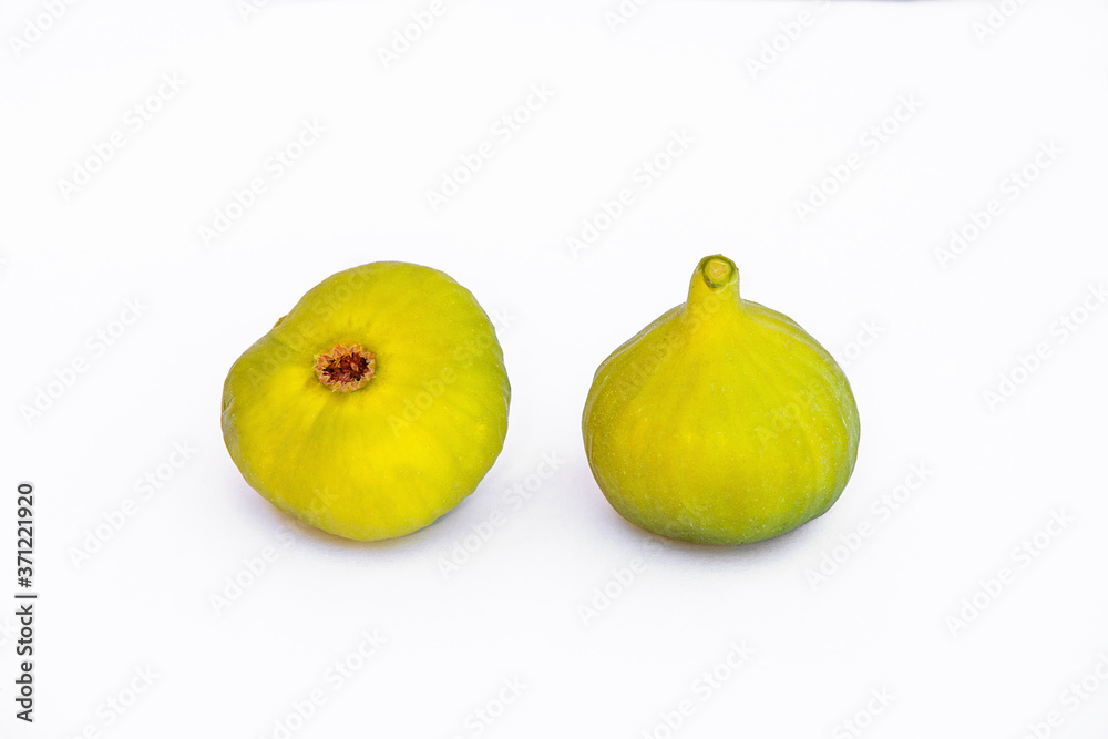Isolated two ripe figs fruit on white background. Isolated two ripe figs fruit on white background.