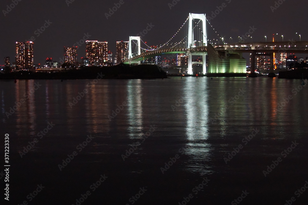 Tokyo, Japan at Rainbow Bridge and Tokyo Bay.