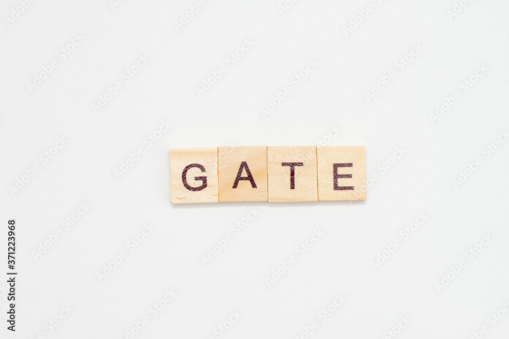 Word GATE made from wooden cubes on white. Word GATE made from wooden cubes on white.