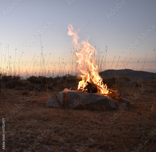 Bonfire in front of Mountain summit