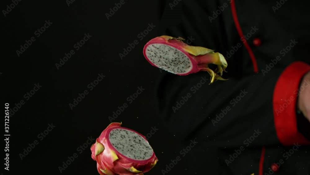 Super Slow Motion Shot of Chef Chopping Pitahaya in the air at 1000 fps. Super Slow Motion Shot of Chef Chopping Pitahaya in the air at 1000 fps.