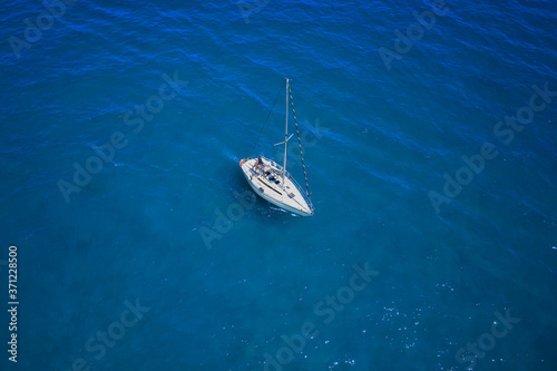 Aerial view to White yacht in blue sea. Drone photography © Berg