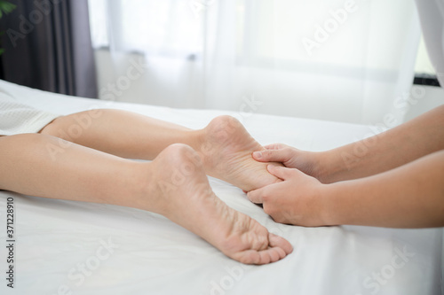 Woman receiving a foot massage at the health spa