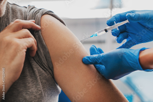 Vaccination of senior person in hospital
