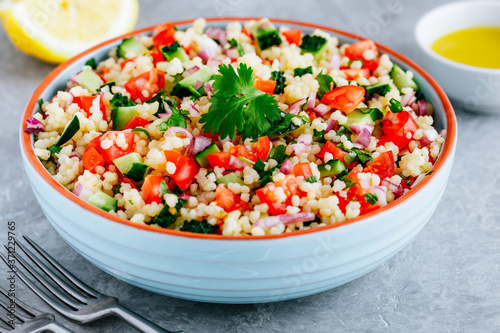 Couscous Tabbouleh Salad with fresh tomatoes, cucumbers and red onions