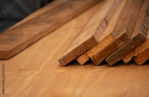 Background with copy space. Six plank woods strack on plywood board. Selective focus. photo