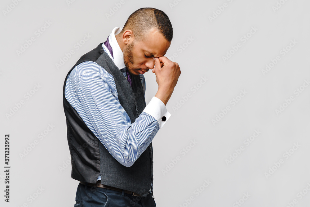 Young afro american businessman touching head because of headache and stress Young afro american businessman touching head because of headache and stress