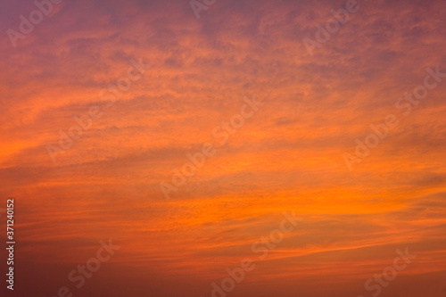 Colorful beautiful sunset with the orange cloud background © BINGJHEN
