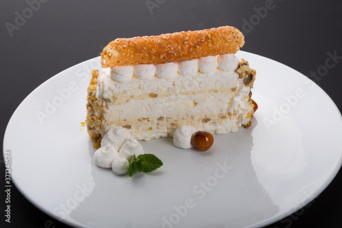 Slice of sweet merigue cake photo