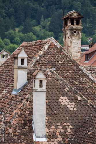Aerial view on red tiled roofs of medieval Brasov town in Transylvania, Romania. Europe