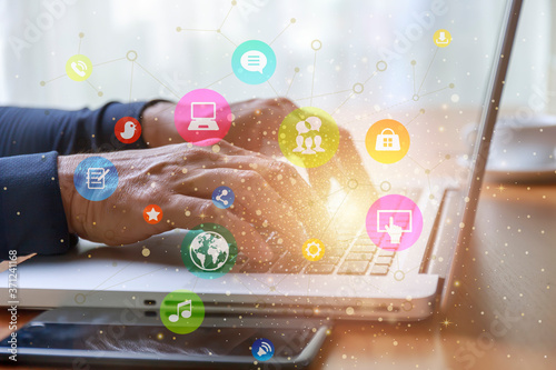 Lifestyle and technology concept  Close up man hands with laptop and social media web chart background. Man hands use computer network connect to social media around the world.