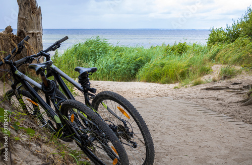 Fototapeta Naklejka Na Ścianę i Meble -  Two mountain bikes at the baltic sea in germany
