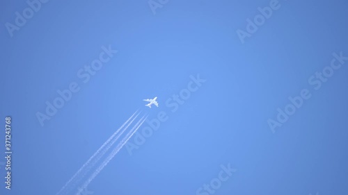 Aircraft Contrail Against Clear Blue Sky.